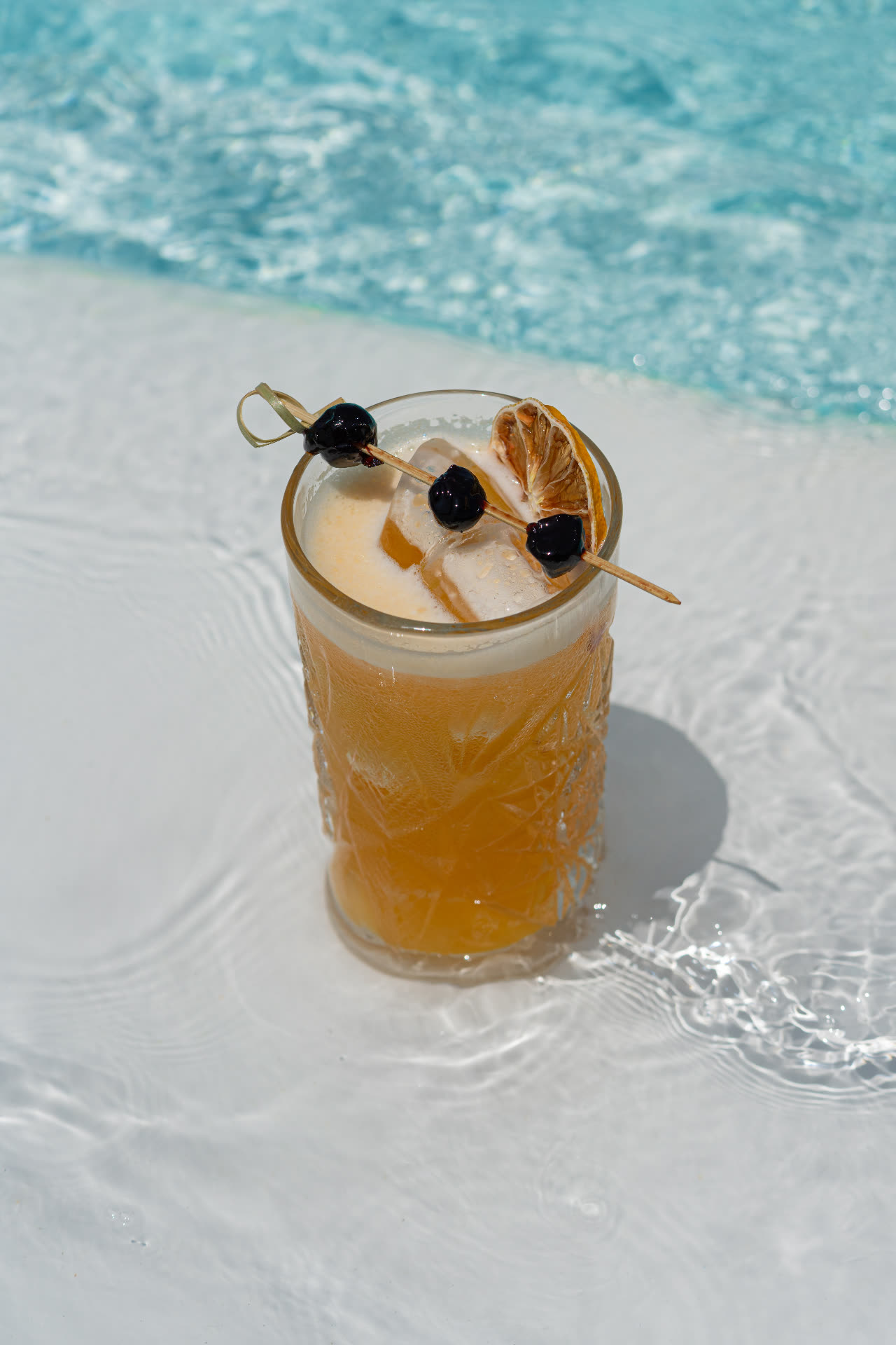 Amber signature cocktail by the pool at Barbarossa Mykonos