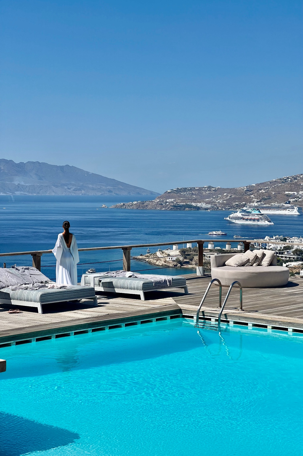 Tharroe of Mykonos pool terrace overlooking the Aegean, windmills and old port